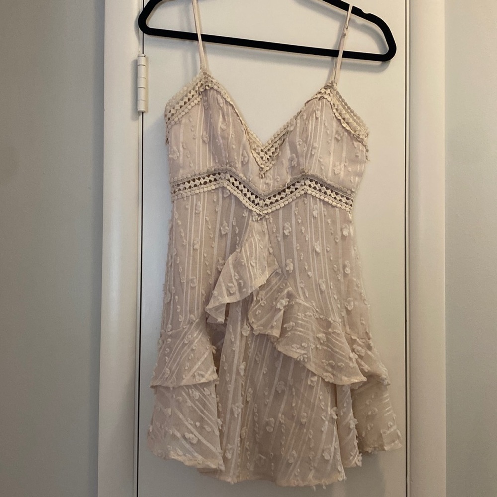 Cream colored cute dress with fun detailing